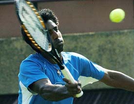 India's Prakash Amritraj hits a shot during his match against Sun Peng of China in New Delhi on Sunday