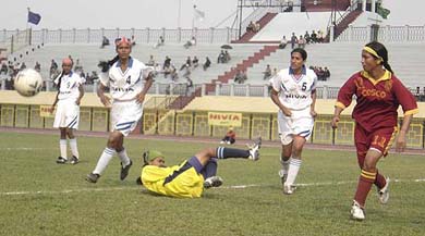 Women footballers from Kerala and West Bengal fight for the ball