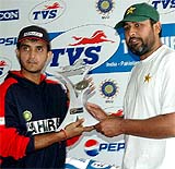 Indian skipper Sourav Ganguly and his Pakistani counterpart Inzamam-ul-Haq jointly hold the Test trophy unveiled at the PCA Stadium in Mohali 