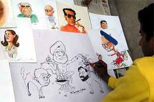 George, a Amritsar-based cartoonist, makes a caricature depicting the political impasse in Bihar