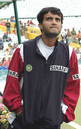 Sourav Ganguly has a look at the overcast sky as he waits for rain to stop on the second day of the first Test against Pakistan in Mohali on Wednesday.