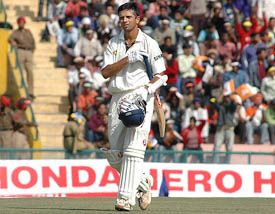 Rahul Dravid walks back to the pavilion after his dismissal on the third day of the first Test in Mohali