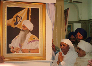 SGPC president Bibi Jagir Kaur stands near the portrait of Bhai Harbhajan Singh Yogi, which she unveiled in the Central Sikh Museum on the Harmandar Sahib complex in Amritsar on Friday. 