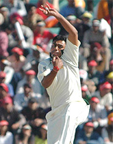 Danish Kaneria bowls during the fourth day�s play of the first Test in Mohali on Friday