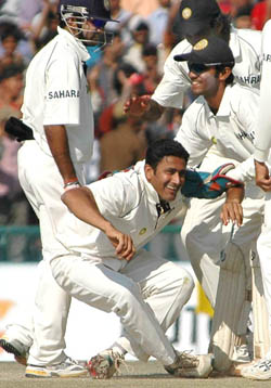 Team-mates congratulate Anil Kumble after he dismissed Pakistan�s Mohammad Sami to pick up his 450th Test wicket on the fifth day of the Mohali Test on Saturday