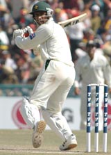 Pakistan all-rounder Abdul Razzaq plays a shot on the fifth day of the first Test against India in Mohali on Saturday