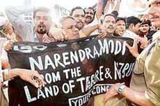 Youth Congress activists block Gujarat Chief Minister Narendra Modi’s car at Netaji Subhas Chandra Bose airport in Kolkata on Sunday.