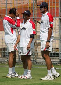 Sourav Ganguly talks to Sachin Tendulkar and Anil Kumble during a practice session in Kolkata on Tuesday