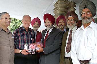 Dr Norman E. Borlaug being received by the Punjab Agricultural University Vice-Chancellor and other scientists on the campus in Ludhiana on Friday.