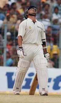 A dejected Sachin Tendulkar walks back to the pavilion after umpire Steve Bucknor wrongly ruled him out caught behind off Abdur Razzaq on the third day of second Test in Kolkata  on Thursday