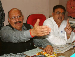 Mr Surinder Arjun (right), officiating president of Durgiana Management Committee, and Mr Rajinder Bhalla, councillor, address a press conference at Durgiana Temple in Amritsar on March 20. 