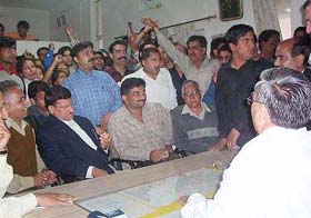 Residents protest in the office of the Executive Officer of the MC, Pathankot, after the death of a woman of jaundice