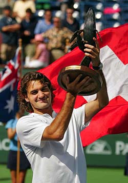 Roger Federer of Switzerland holds up his trophy after defeating Lleyton Hewitt of Australia in the final of the Pacific Open in Indian Wells on Sunday