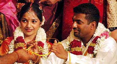 Sri Lankan cricketer Muttiah Muralitharan and his bride Madhimalar performing Hindu marriage rituals during their wedding ceremony in Chennai on Monday