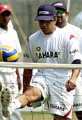 Sachin Tendulkar plays with a ball during a practice session at Chinnaswamy stadium in Bangalore on Wednesday