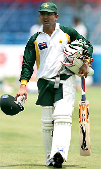 Pakistani wicketkeeper Kamran Akmal leaves the ground after attending a practice session in Bangalore on Wednesday