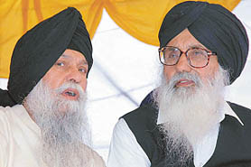 Mr Parkash Singh Badal, Shiromani Akali Dal President, has a word with Capt Kanwaljit Singh at Anandpur Sahib on Friday. 