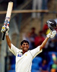 Younis Khan celebrates after completing a double century during the third Test in Bangalore