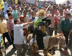 Traders carry an effigy of VAT on a donkey in Amritsar during the bandh on Wednesday. 