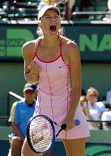 Maria Sharapova of Russia celebrates after defeating Justine Henin-Hardenne of Belgium at the Nasdaq-100 Open in Key Biscayne, Florida