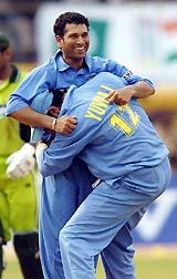 Sachin Tendulkar is congratulated by team-mate Yuvraj Singh after taking the wicket of Pakistan�s Mohammad Sami during the first one-day match in Kochi on Saturday