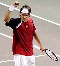Roger Federer from Switzerland celebrates his victory over Andre Agassi during their semifinal match at the NASDAQ-100 in Florida on Friday