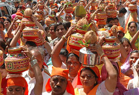 Devotees take part in Jalkalash Shobha Yatra in Jalandhar on Monday.