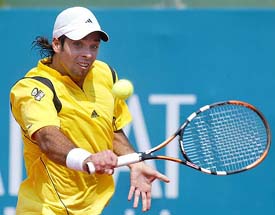Fernando Gonzalez of Cuba returns a backhand to Felix Mantilla of Spain during their second round match at the Comunidad Valenciana Open in Valencia on Wednesday