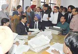 The Supreme Court Judges, Mr Justice N. Santosh Hegde and Mr Justice Ashok Bhan, the Chief Justice of Punjab and Haryana High Court, Mr Justice D.K. Jain, and Mr Justice H.S. Bedi hear the litigants at the national-level Lok Adalat held in Ludhiana on Sunday.