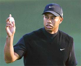 Tiger Woods reacts after scoring a birdie on the 10th hole during the third round of the 2005 US Masters tournament to begin at Augusta National Golf Club in Augusta