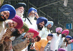 Sikh jatha members wait for the train at Attari railway station on Monday.