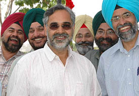 The newly elected president of the Golf Club, G.S. Sandhu, surrounded by supporters, is all smiles after the declaration of election results