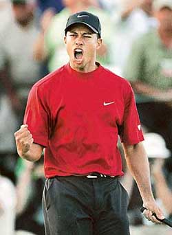 Tiger Woods rejoices after winning the US Masters tournament on the first hole of a sudden-death playoff over Chris DiMarco at the Augusta National Golf Club in Augusta, Georgia, on Sunday