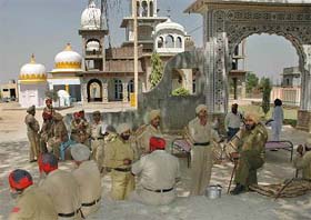 A Punjab police contingent guards Dera Bhai Khajaan Singh following a clash between two communities at Mahem village, near Nakodar