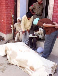 Bodies of two family members of Mr Sadhu Singh lying outside the mortuary at Government Rajindra Hospital in Patiala