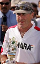 Indian cricket team coach John Wright holds a memento during the prize distribution ceremony after the sixth one-day match in New Delhi