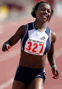 Athens Olympics 200m gold medalist Veronica Campbell of Jamaica celebrates as she wins the women's 100m dash invitational in 10.98 seconds at the Mount San Antonio College relays in Walnut
