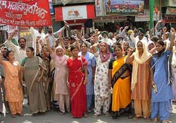Members of families of the PSEB employees protest against the move to privatise the PSEB in Bathinda on Wednesday. A Tribune photograph