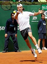 Argentinine Guillermo Coria returns a ball to Dutchman Peter Wessels during their second-round match at the Barcelona Open in Spain on Wednesday