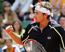 Spanish player Juan Carlos Ferrero celebrates his victory over compatriot Feliciano Lopez during their second round match at the Barcelona Open in Spain on Wednesday. Ferrero won 6-4, 6-4
