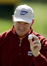World No. 3 Ernie Els acknowledges the crowd after sinking his putt on the 17th hole during the first round of the Johnnie Walker Classic at the Pine Valley Golf Resort in Beijing on Thursday