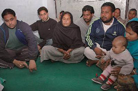 Ms Charanjit Kaur, widow of train driver Avtar Singh, sitting among her four sons and a daughter-in-law. 