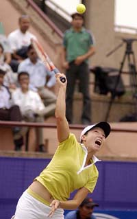 Jie Zheng of China playing against Rushmi Chakravarthi of India  during the Federation Cup in New Delhi