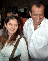 Tennis player Sania Mirza with her father Imran after a press conference at Press club of India in New Delhi