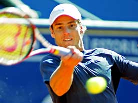 Gaston Gaudio of Argentina returns the ball to Jan Hernych of the Czech Republic in their first round tennis match at the Estoril Open in Portugal on Monday