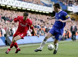 Chelsea captain John Terry  struggles for the ball with Liverpool captain Steven Gerrard during their Champions League semifinal first-leg match at Stamford Bridge in London on Wednesday