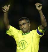 Brazilian football star Romario de Souza Faria celebrates his goal against Guatemala during a friendly match in Sao Paulo