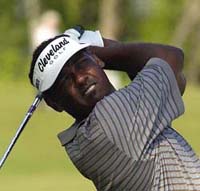Vijay Singh watches his tee shot on the 9th tee in the second round of the Zurich Classic