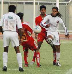 Mohun Bagan�s Noel Wilson tries to gain possession of the ball as team-mate Dulal Biswas (left) looks on, in a National Football League match against JCT Mills at Ludhiana�s Guru Nanak Stadium on Saturday