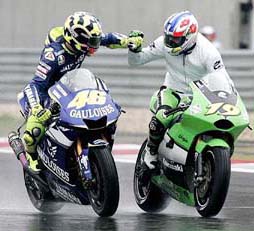Italy's Valentino Rossi and France's Olivier Jacque congratulate each other